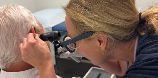 “SmartMED primary care provider meeting with patient in Roswell clinic”